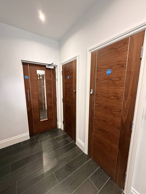 Communal landing with three walnut fire doors
